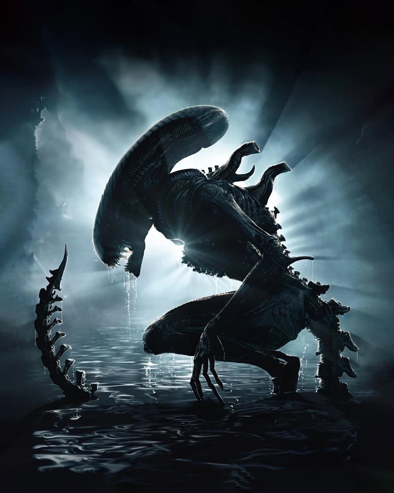 A xenomorph lit from below in a dark corridor.
